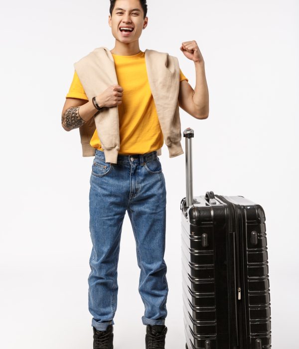 Finally vacation, pack your things lets go. Vertical full-length shot cheerful smiling, happy young